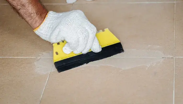 Apply the combined epoxy to the tile's tiny cracks. / how to repair cracks on floor tile?
