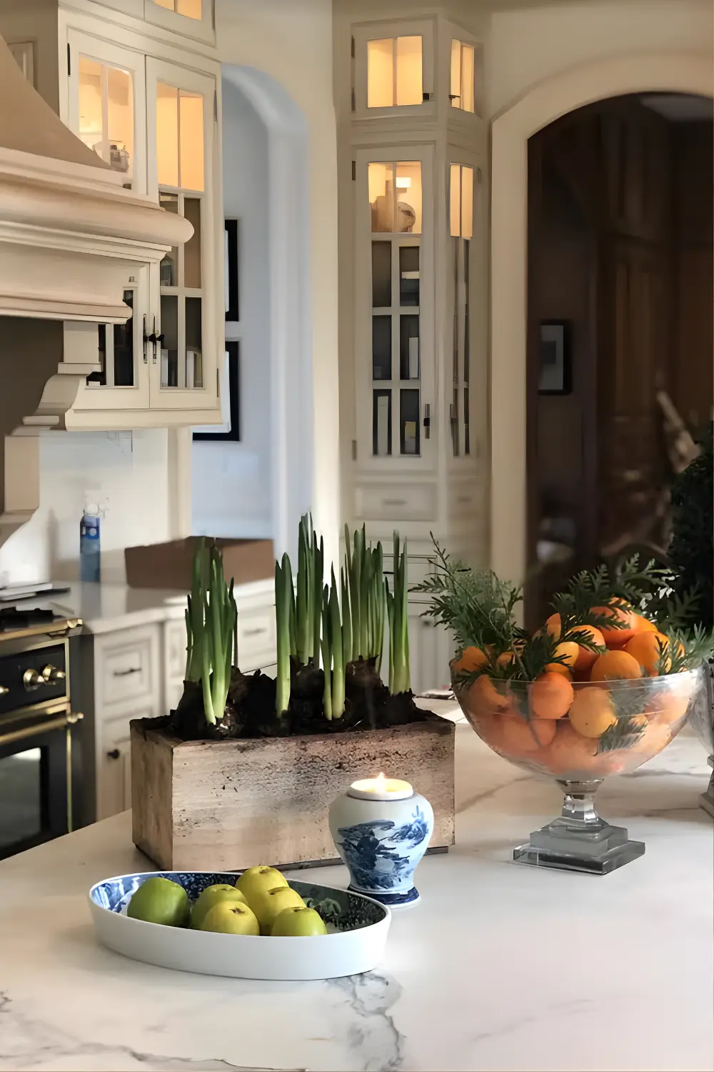 a table with a bowl of fruit and a vase of flowers Christmas Kitchen Decor Ideas