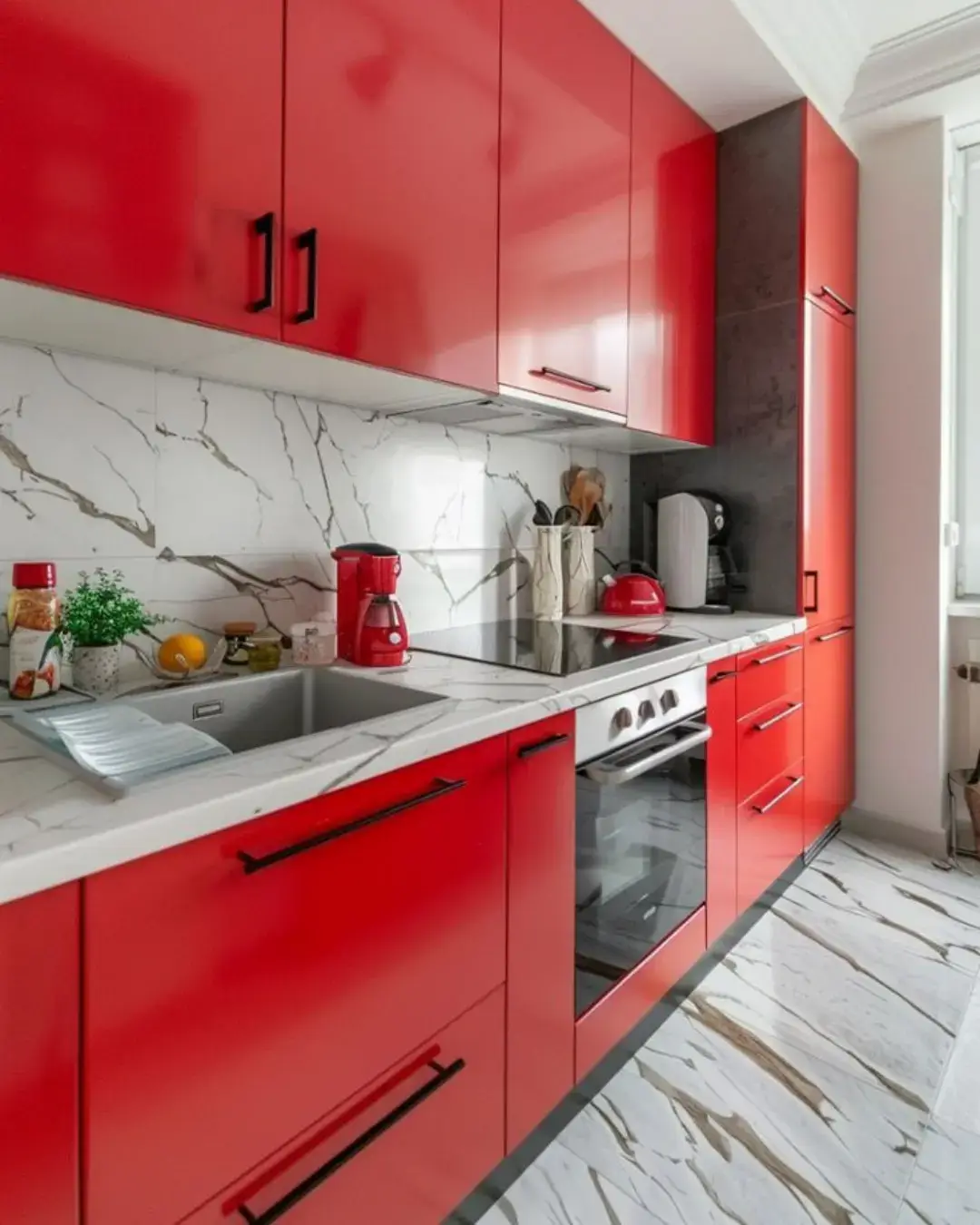 Kitchen Cabinet Colors for White Tile Floors: 11 Best Ideas and Expert Tips 10 A modern kitchen with bold red cabinets, white tile floors, and a white marble countertop, creates a vibrant and eye-catching contrast.