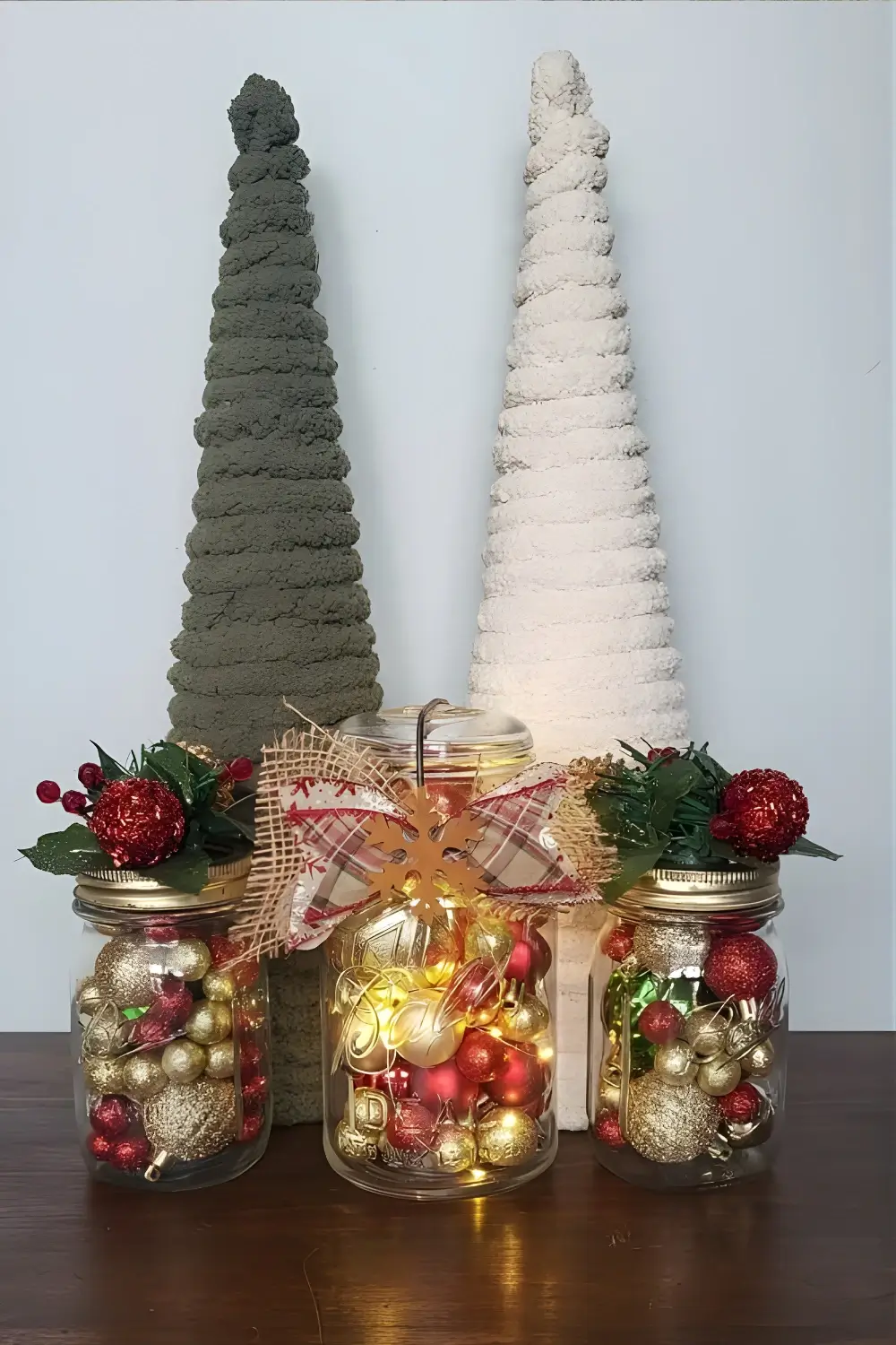 Christmas Cottage Kitchen Décor Ideas: 21 Best Ways to Create a Cozy and Festive Space 21 A set of mason jar luminaries filled with fairy lights, was placed on a kitchen counter surrounded by holiday greenery.